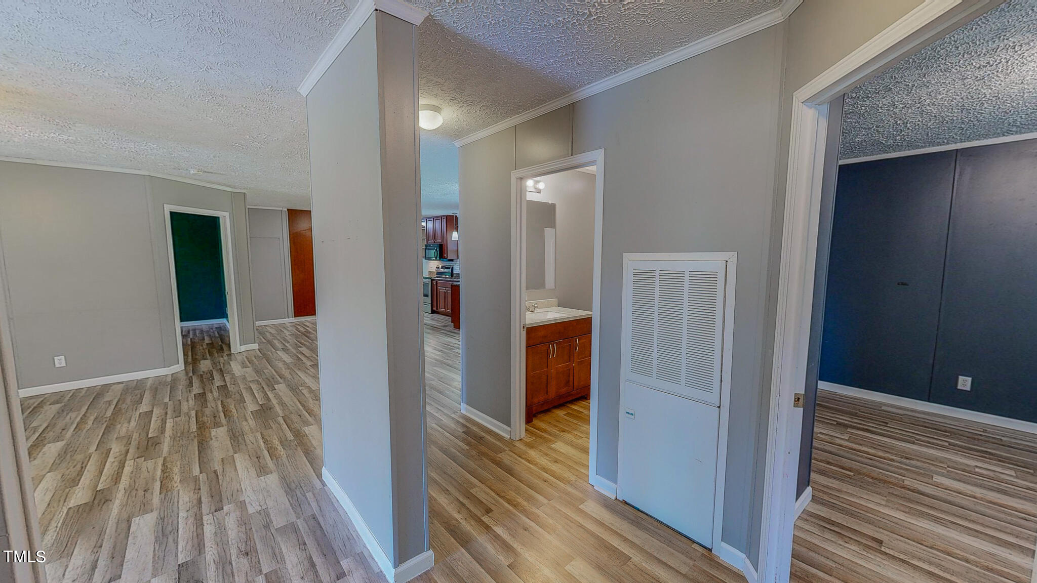 44 Pheasant Way Roxboro, NC 27574 - Photo 42 of 46 a view of a hallway with wooden floor and staircase