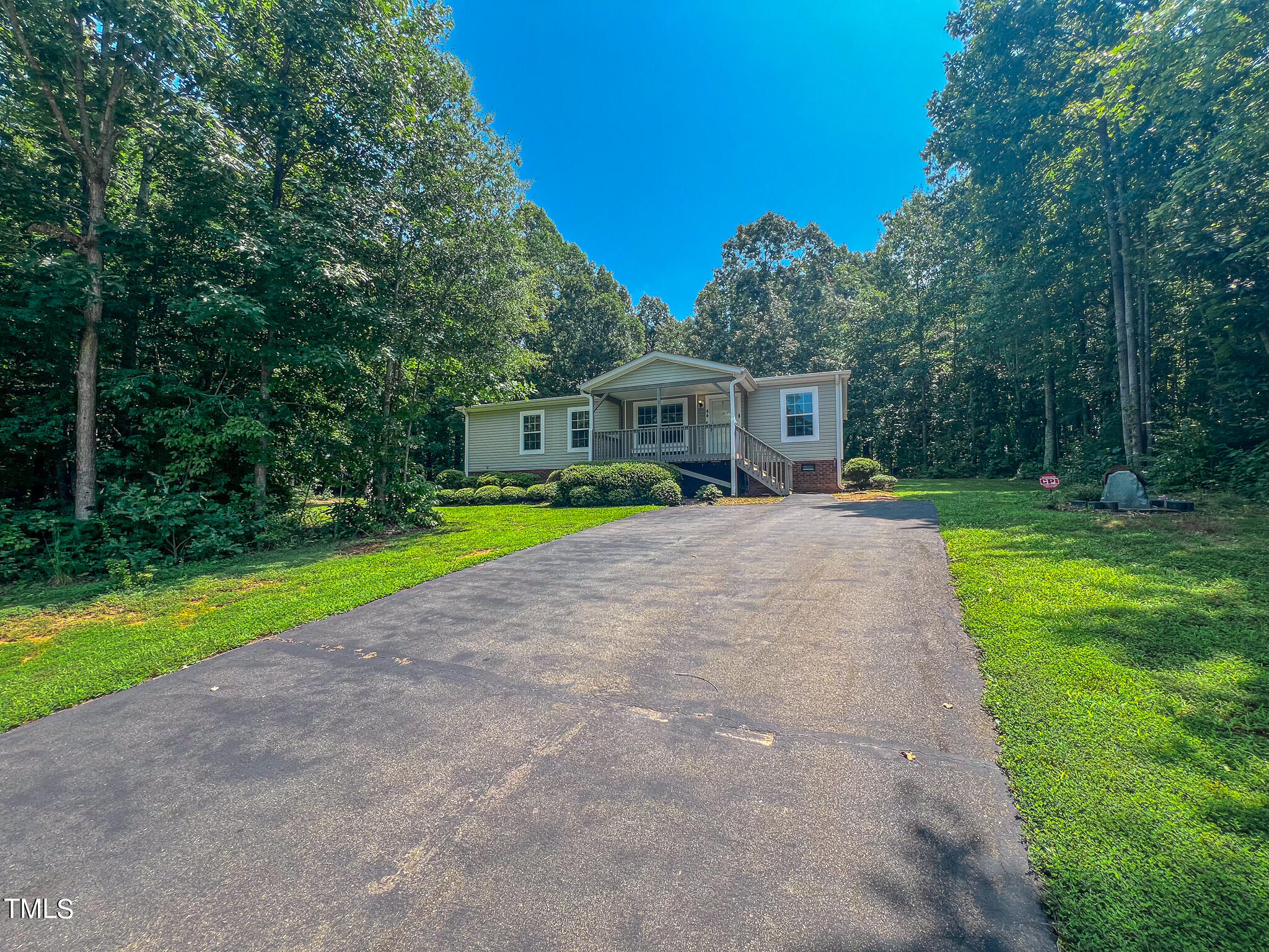 44 Pheasant Way Roxboro, NC 27574 - Photo 44 of 46 a view of a house with a yard and sitting area