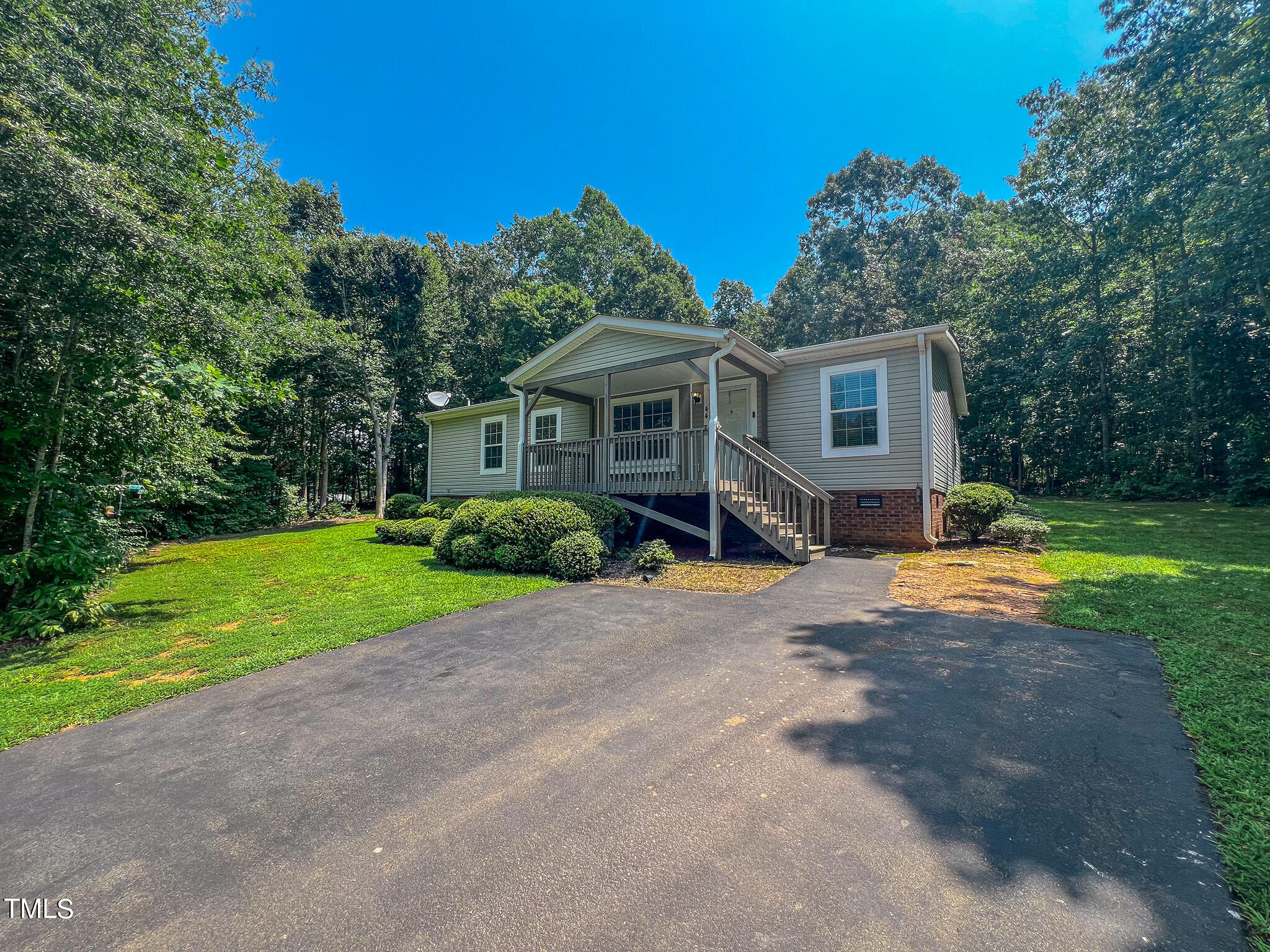 44 Pheasant Way Roxboro, NC 27574 - Photo 45 of 46 a front view of house with yard and green space