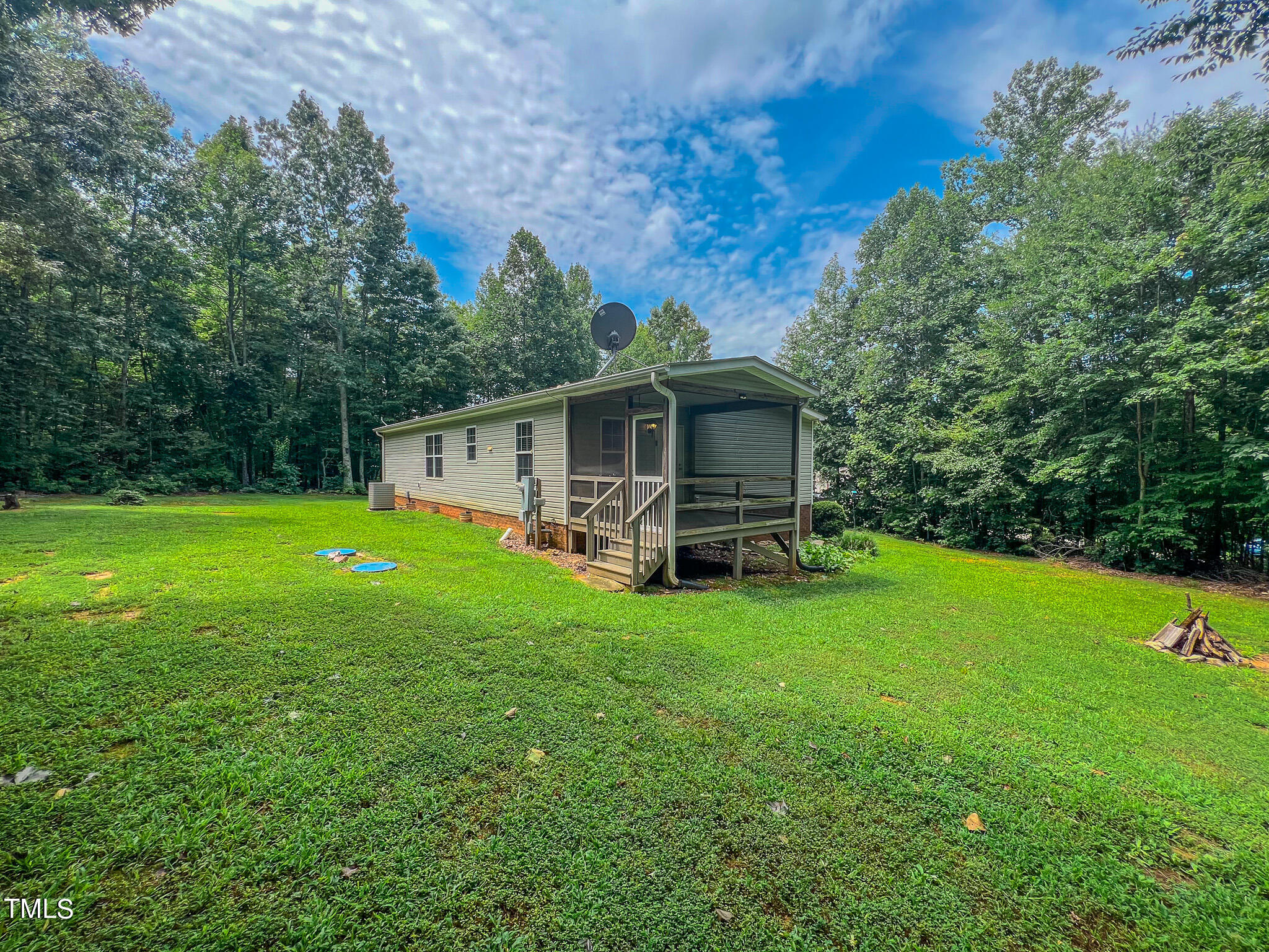 44 Pheasant Way Roxboro, NC 27574 - Photo 7 of 46 a front view of a house with yard and green space