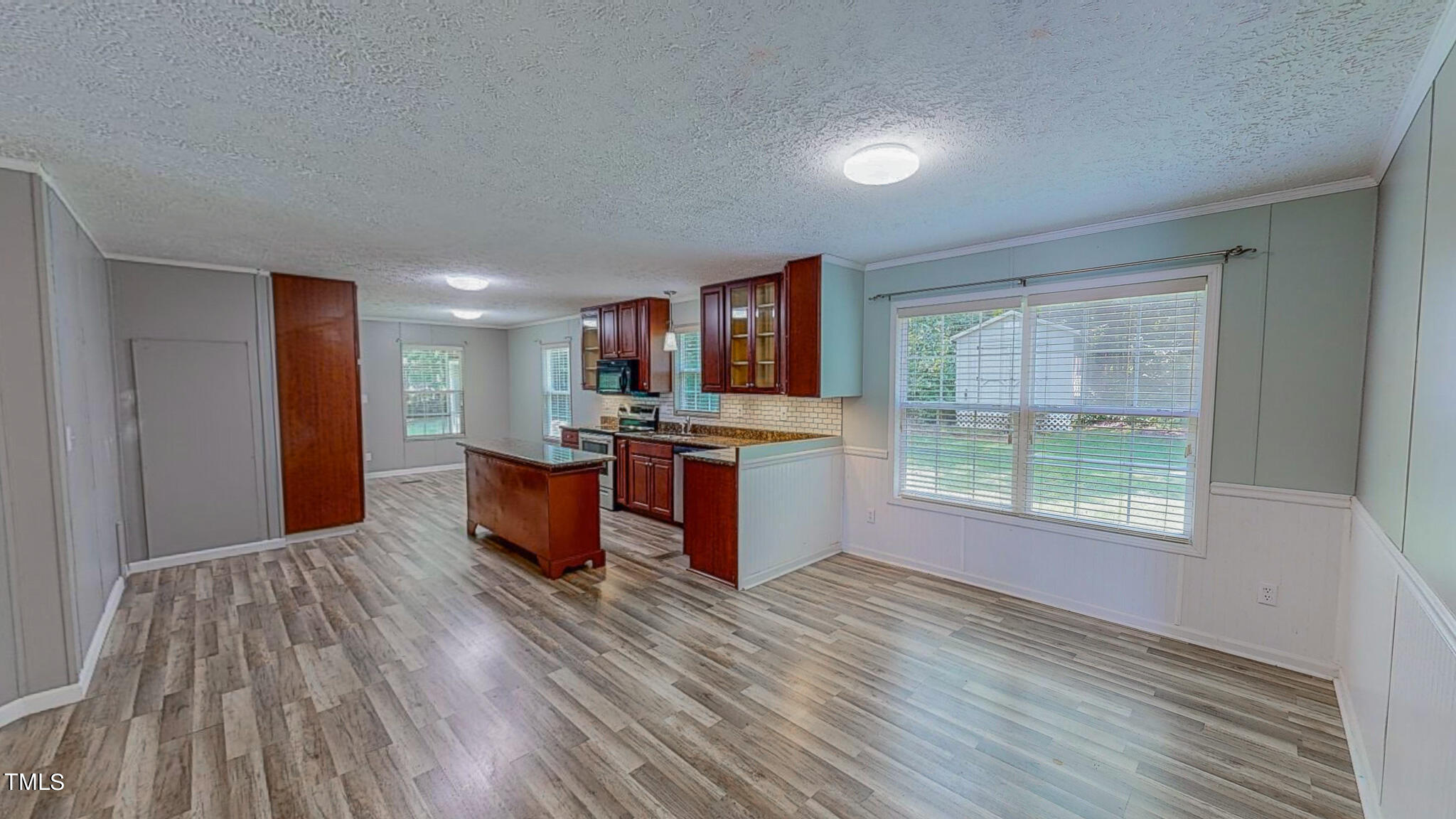 44 Pheasant Way Roxboro, NC 27574 - Photo 8 of 46 a kitchen with stainless steel appliances kitchen island wooden cabinets and granite counter tops