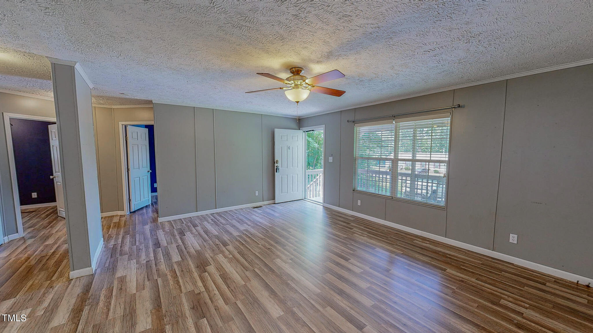 44 Pheasant Way Roxboro, NC 27574 - Photo 10 of 46 wooden floor in an empty room with a window