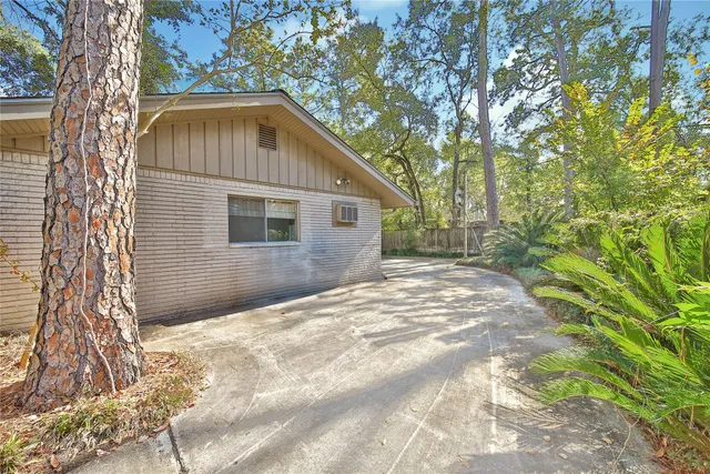 a backyard of a house with large trees