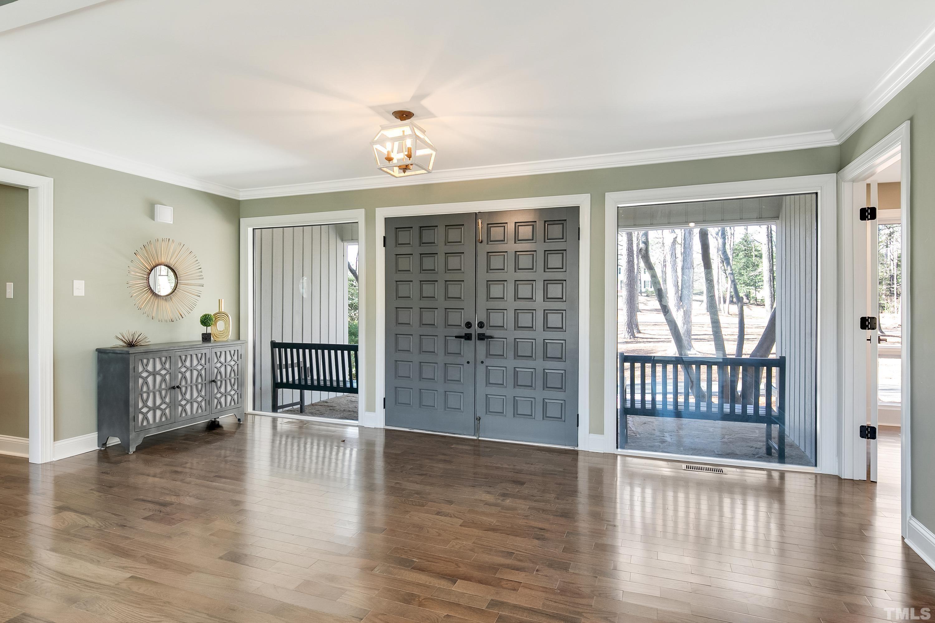 5413 Edington Lane Raleigh, NC 27604 - Photo 2 of 59 an empty room with wooden floor and windows