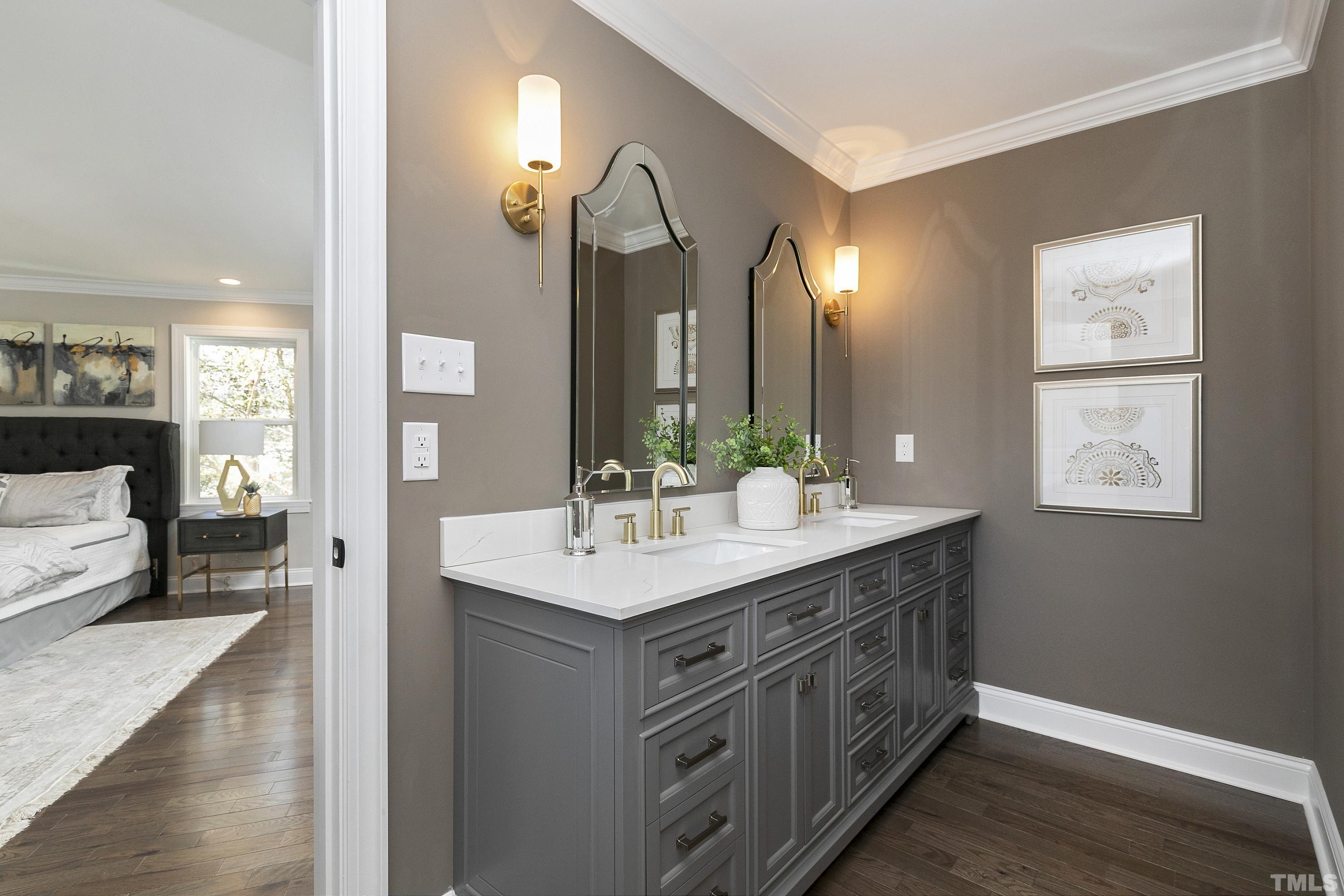 5413 Edington Lane Raleigh, NC 27604 - Photo 22 of 59 a bathroom with a sink a light fixture and a mirror