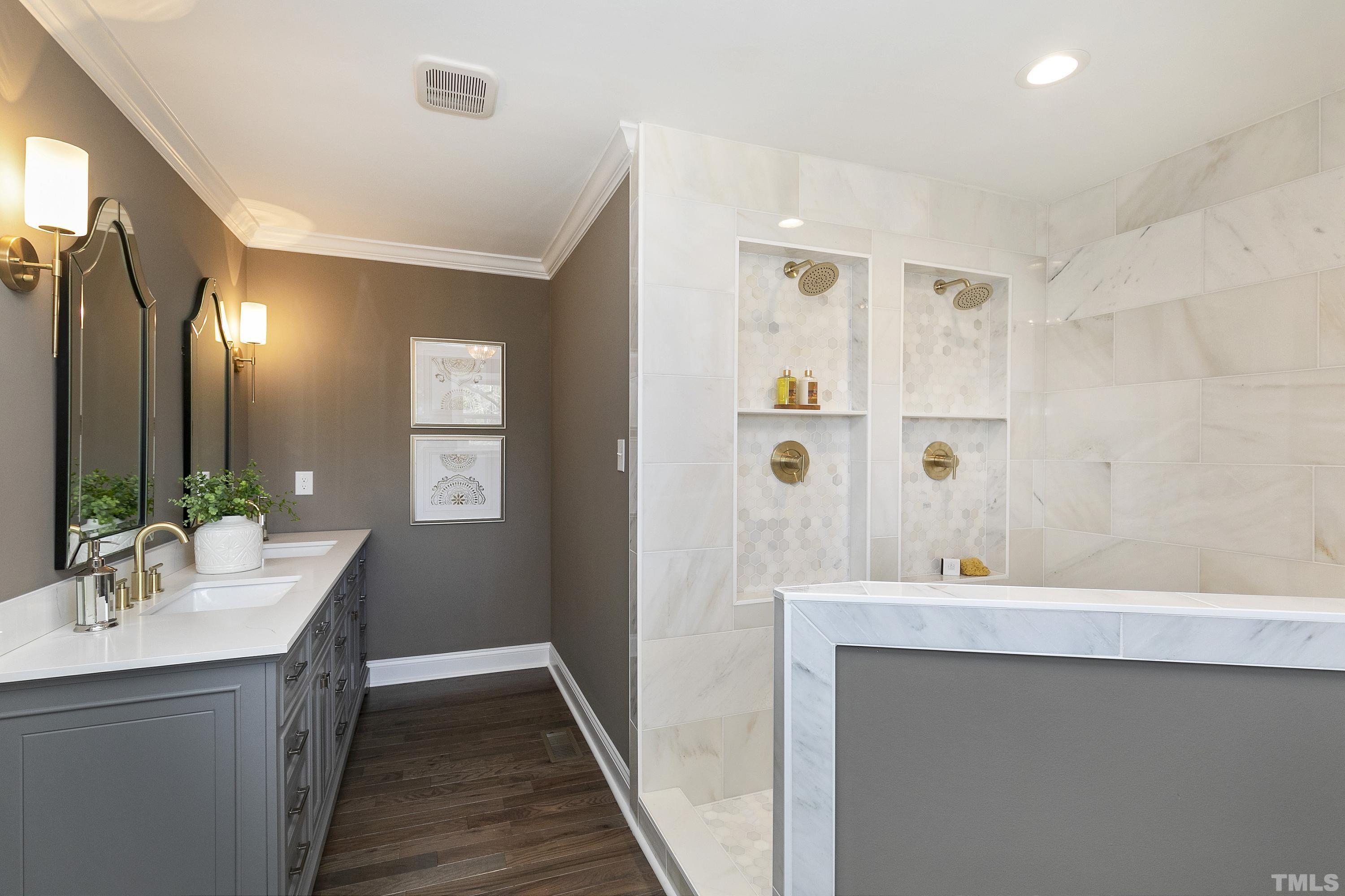 5413 Edington Lane Raleigh, NC 27604 - Photo 24 of 59 a bathroom with a double vanity sink and a mirror