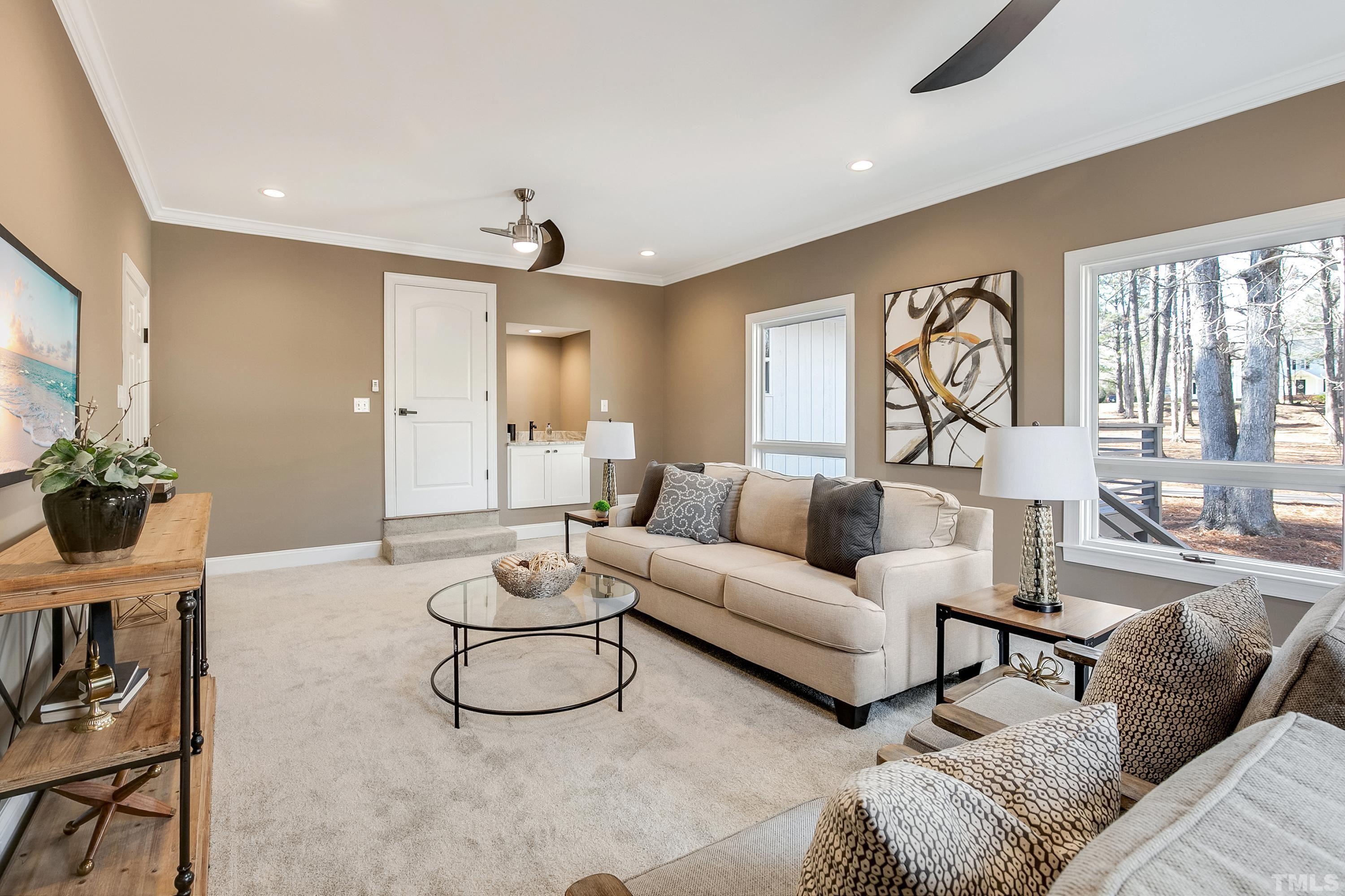 5413 Edington Lane Raleigh, NC 27604 - Photo 28 of 59 a living room with furniture and a table