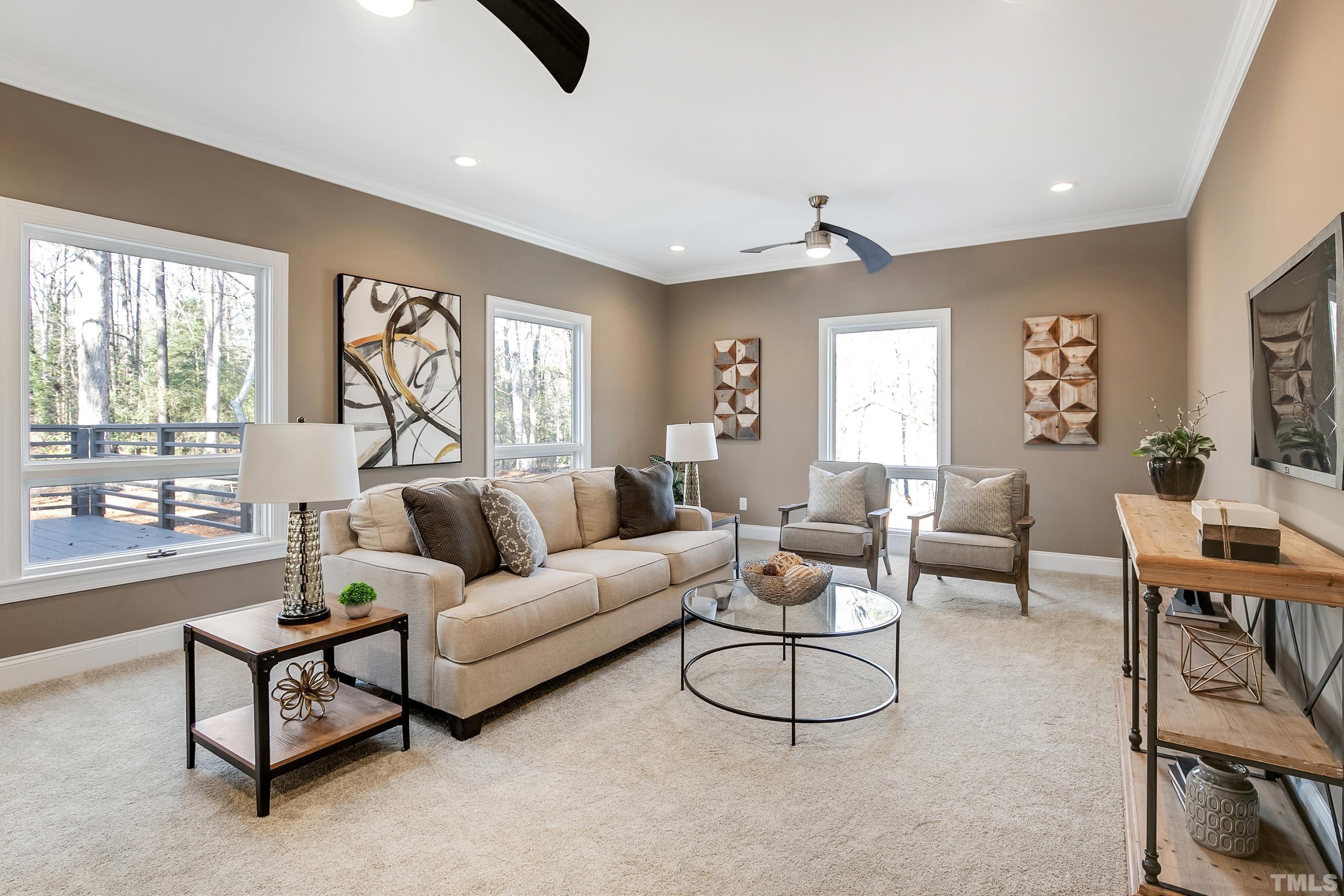 5413 Edington Lane Raleigh, NC 27604 - Photo 29 of 59 a living room with furniture and a large window