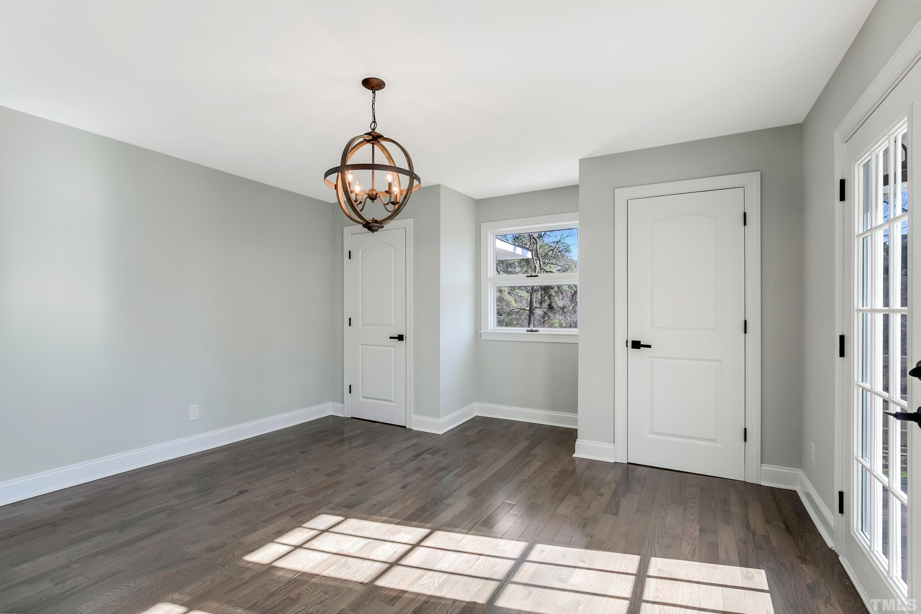 5413 Edington Lane Raleigh, NC 27604 - Photo 36 of 59 a view of a hallway with wooden floor and a window