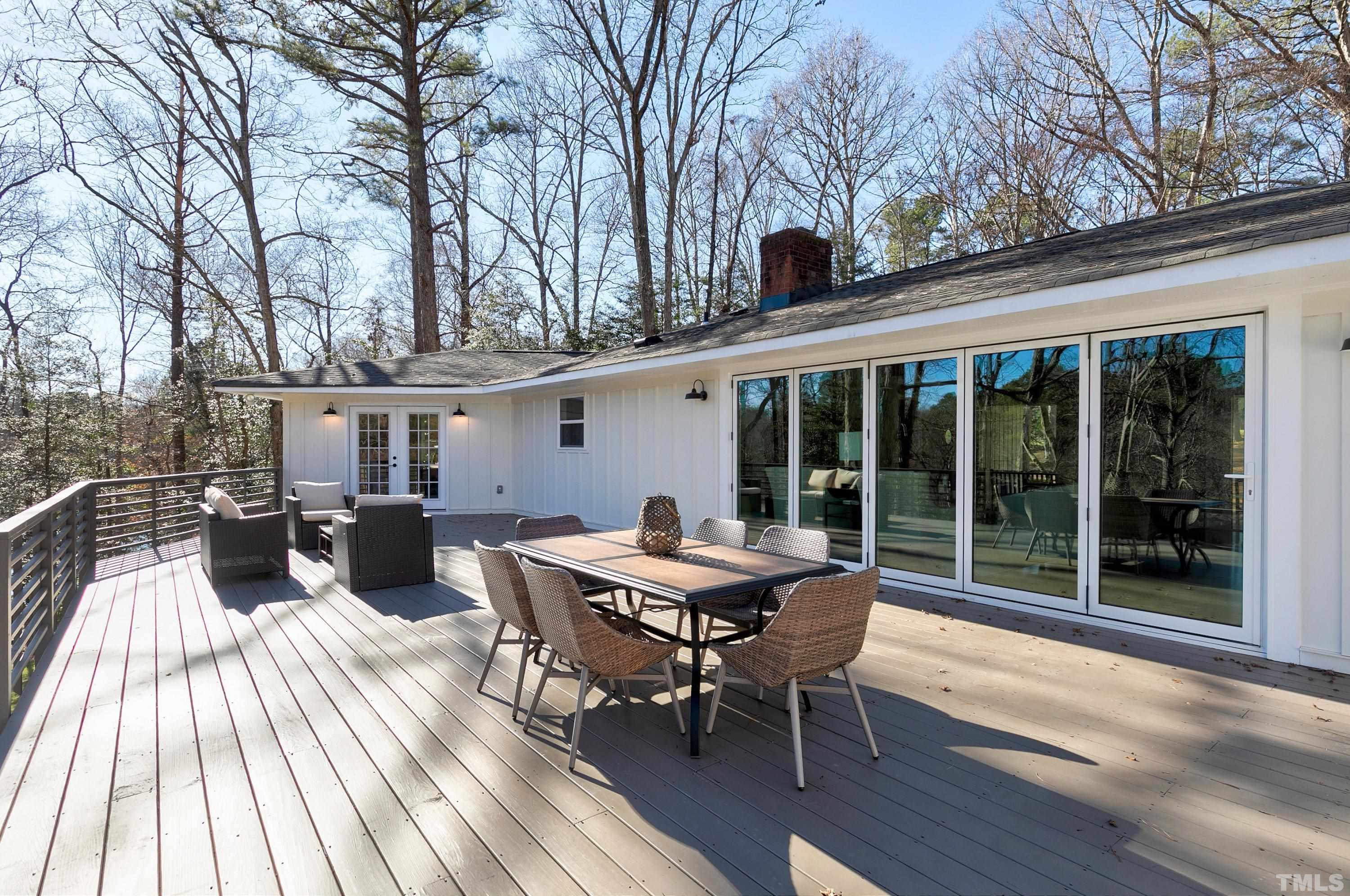 5413 Edington Lane Raleigh, NC 27604 - Photo 43 of 59 a view of a patio with a table and chairs
