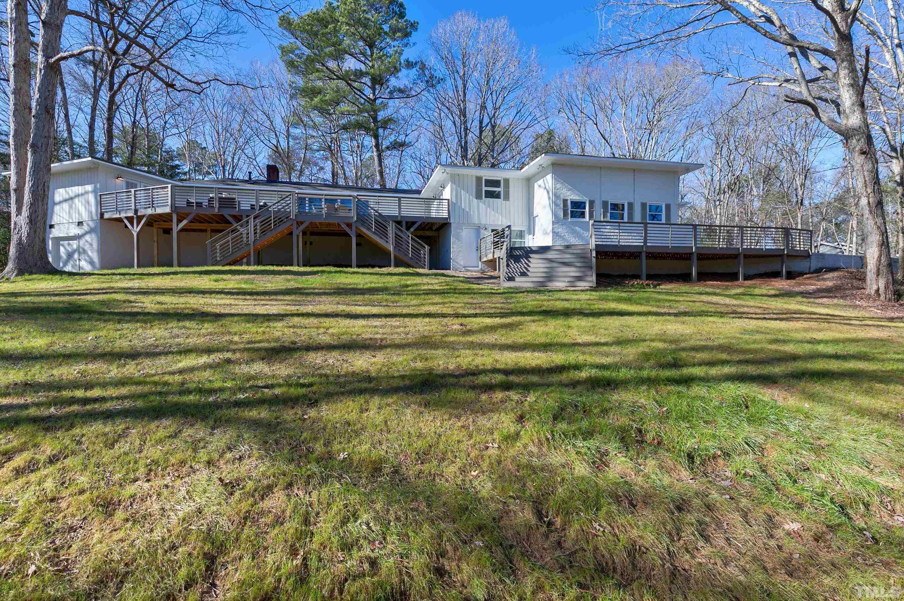 5413 Edington Lane Raleigh, NC 27604 - Photo 45 of 59 a view of a house with a big yard and large trees