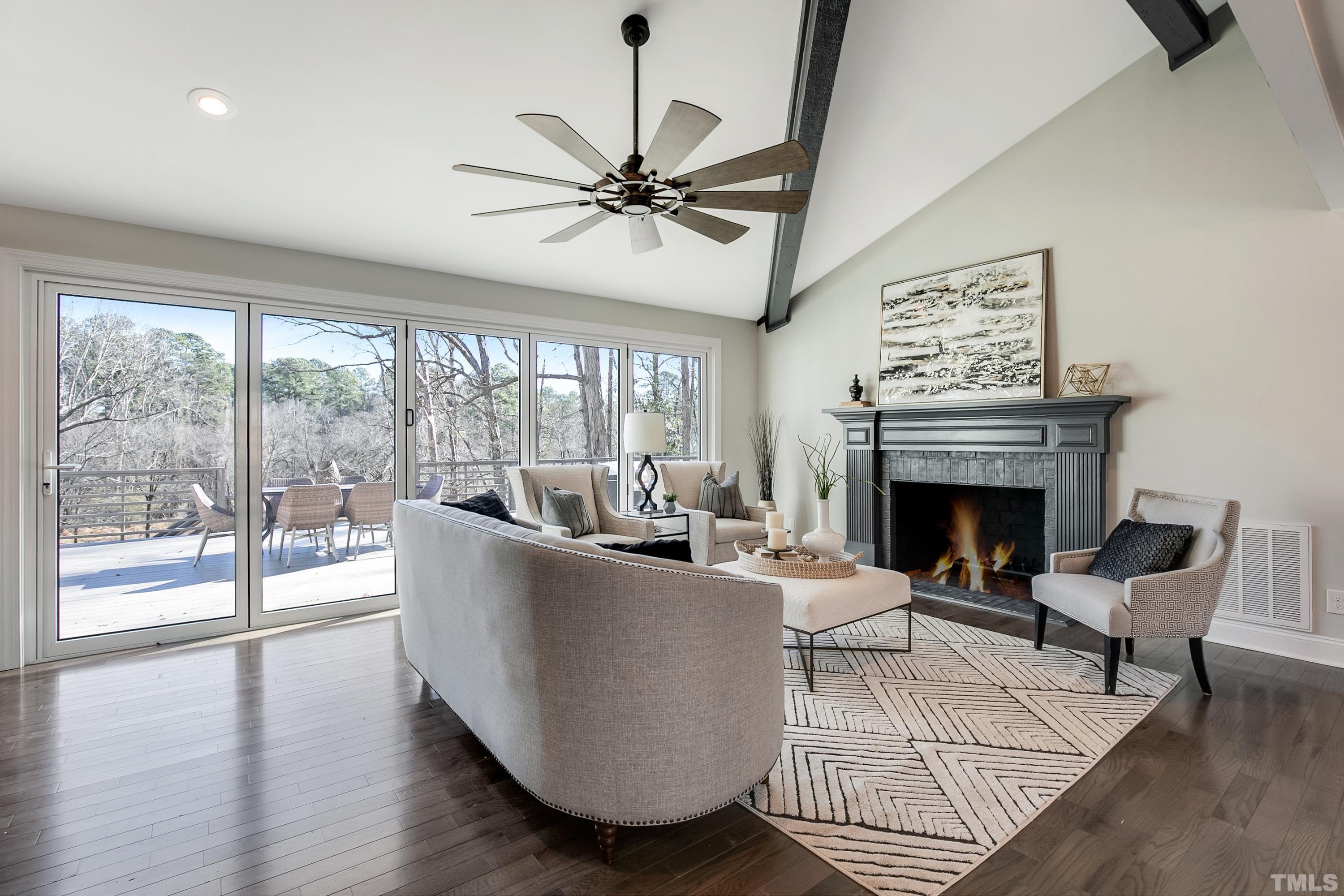 5413 Edington Lane Raleigh, NC 27604 - Photo 5 of 59 a living room with furniture a large window and a fireplace