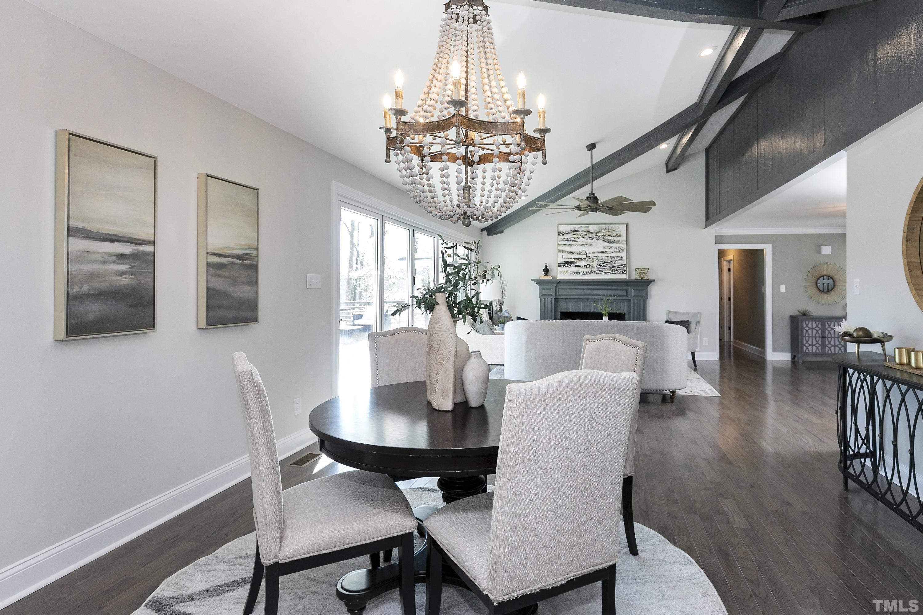 5413 Edington Lane Raleigh, NC 27604 - Photo 10 of 59 a view of a dining room with furniture wooden floor and chandelier
