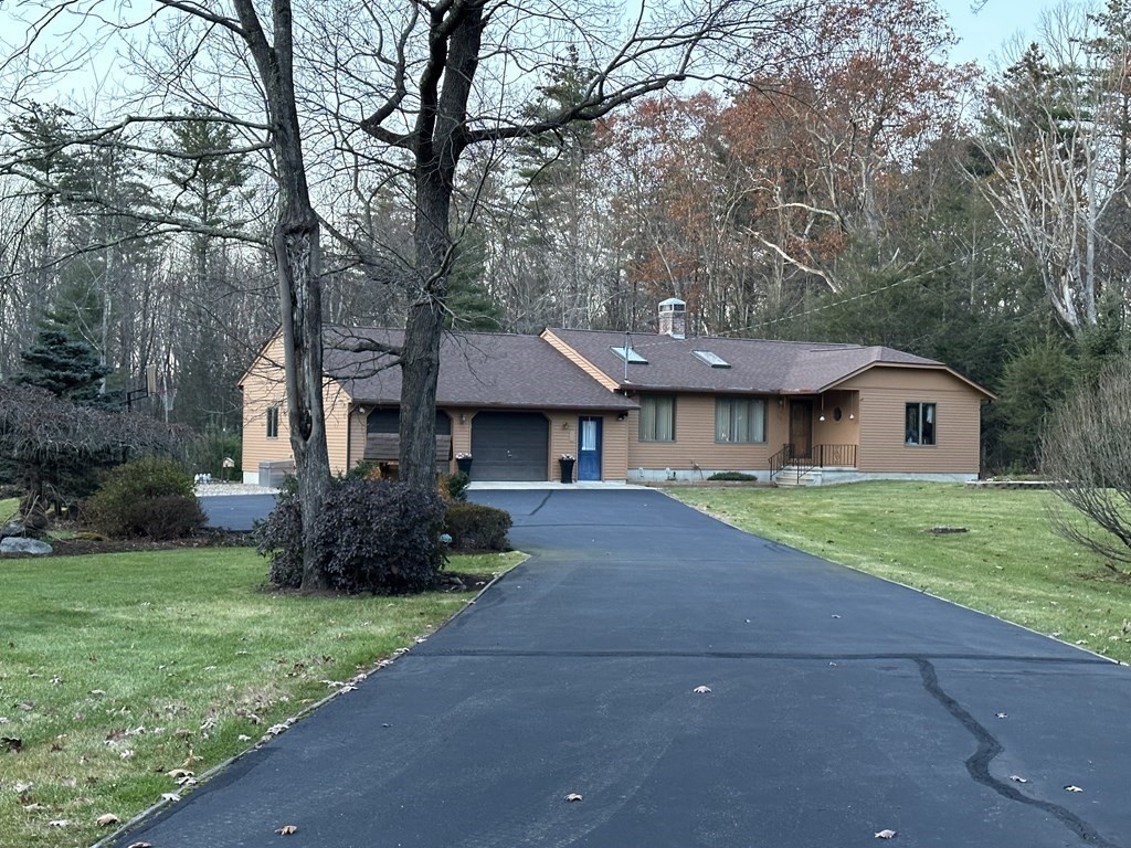 160 Osborne Road Ware, MA 01082 - Photo 1 of 28 a front view of a house with a yard and garage