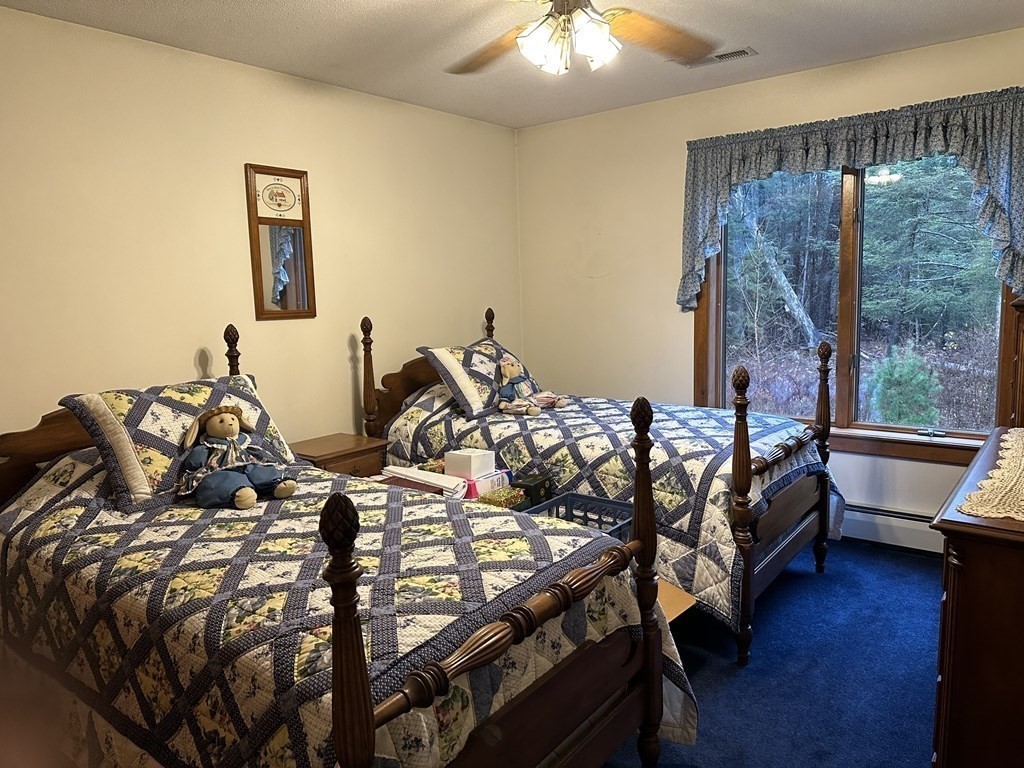 160 Osborne Road Ware, MA 01082 - Photo 13 of 28 a bedroom with two beds and wooden floor