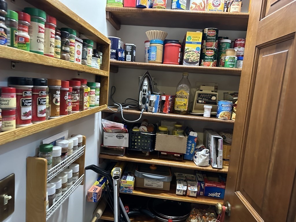 160 Osborne Road Ware, MA 01082 - Photo 9 of 28 a room with lots of books and a refrigerator