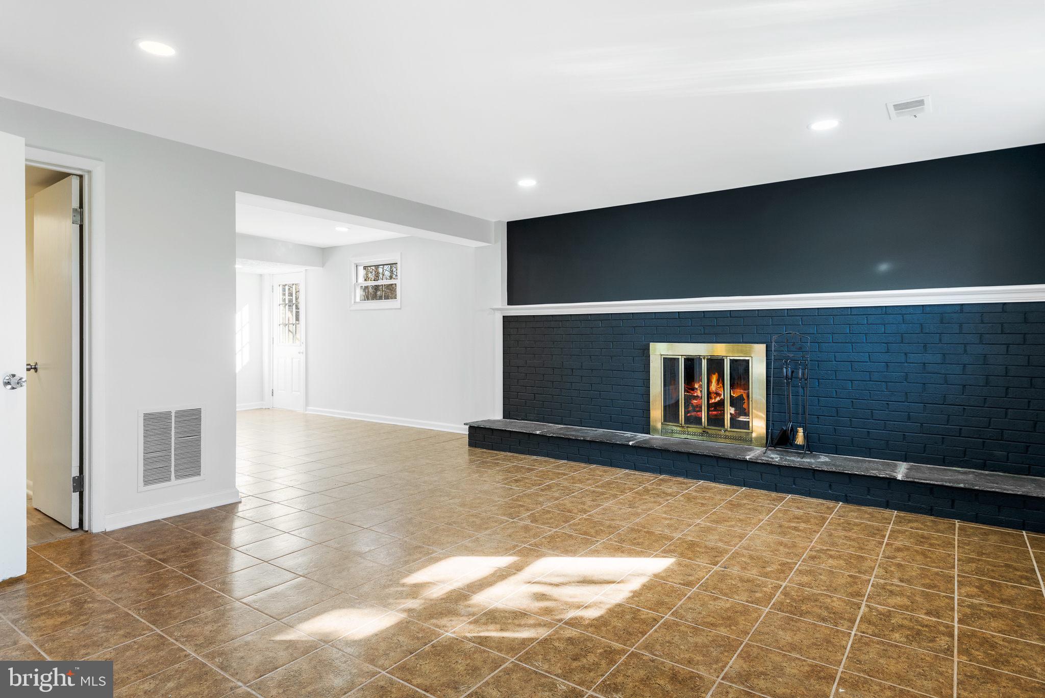 15815 Kerr Road Laurel, MD 20707 - Photo 26 of 38 Second living room with cozy fireplace