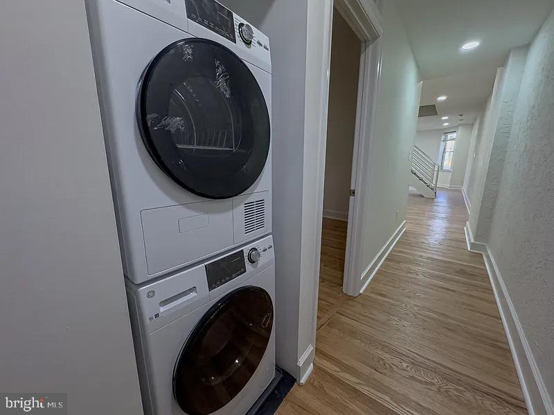 2111 Green Street, Unit 2R Philadelphia, PA 19130 - Photo 18 of 19 a view of a hallway with washer and dryer