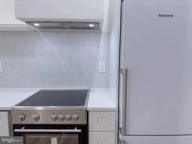 a view of a stove in the kitchen