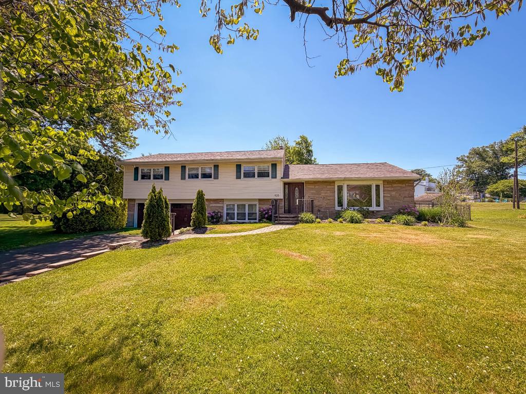 925 Big Oak Road Yardley, PA 19067 - Photo 3 of 51 a front view of a house with swimming pool