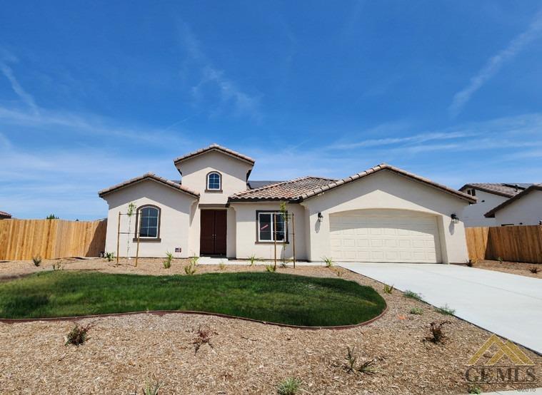 Undisclosed Address Bakersfield, CA 93313 - Photo 1 of 22 a front view of a house with a garden