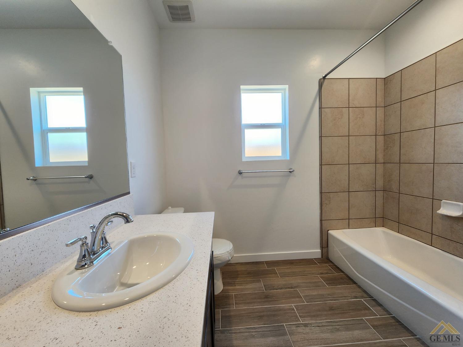 Undisclosed Address Bakersfield, CA 93313 - Photo 16 of 22 a bathroom with a sink and a bathtub