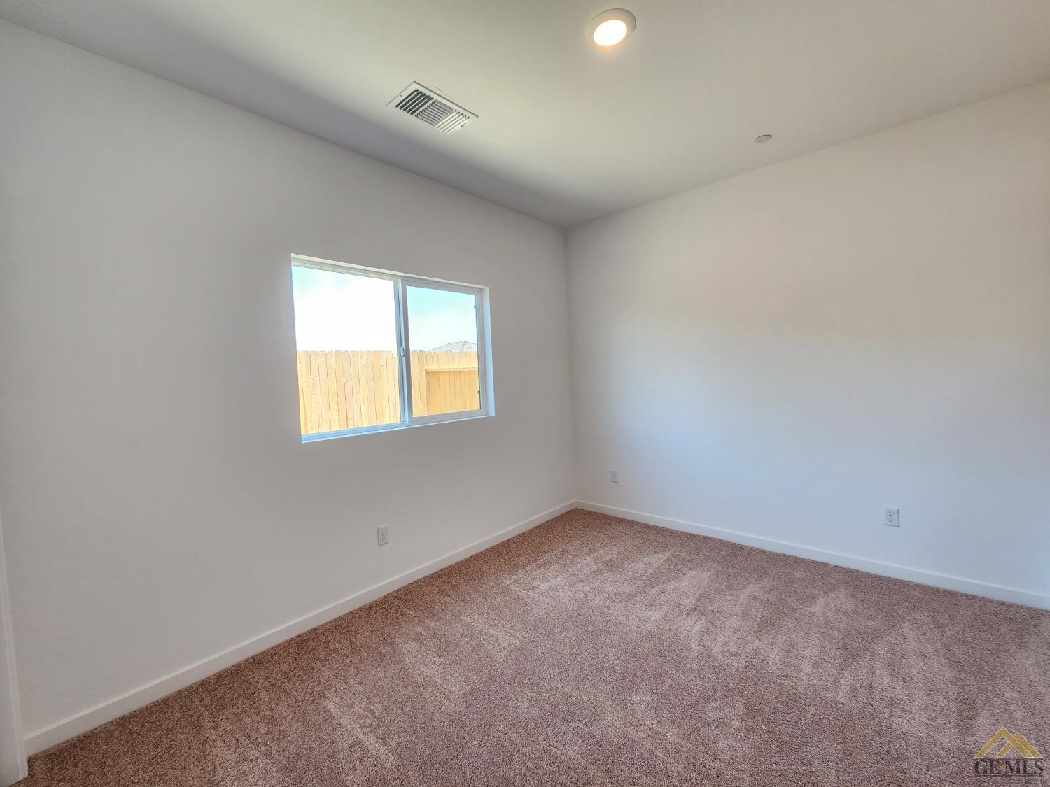 Undisclosed Address Bakersfield, CA 93313 - Photo 17 of 22 an empty room with a window