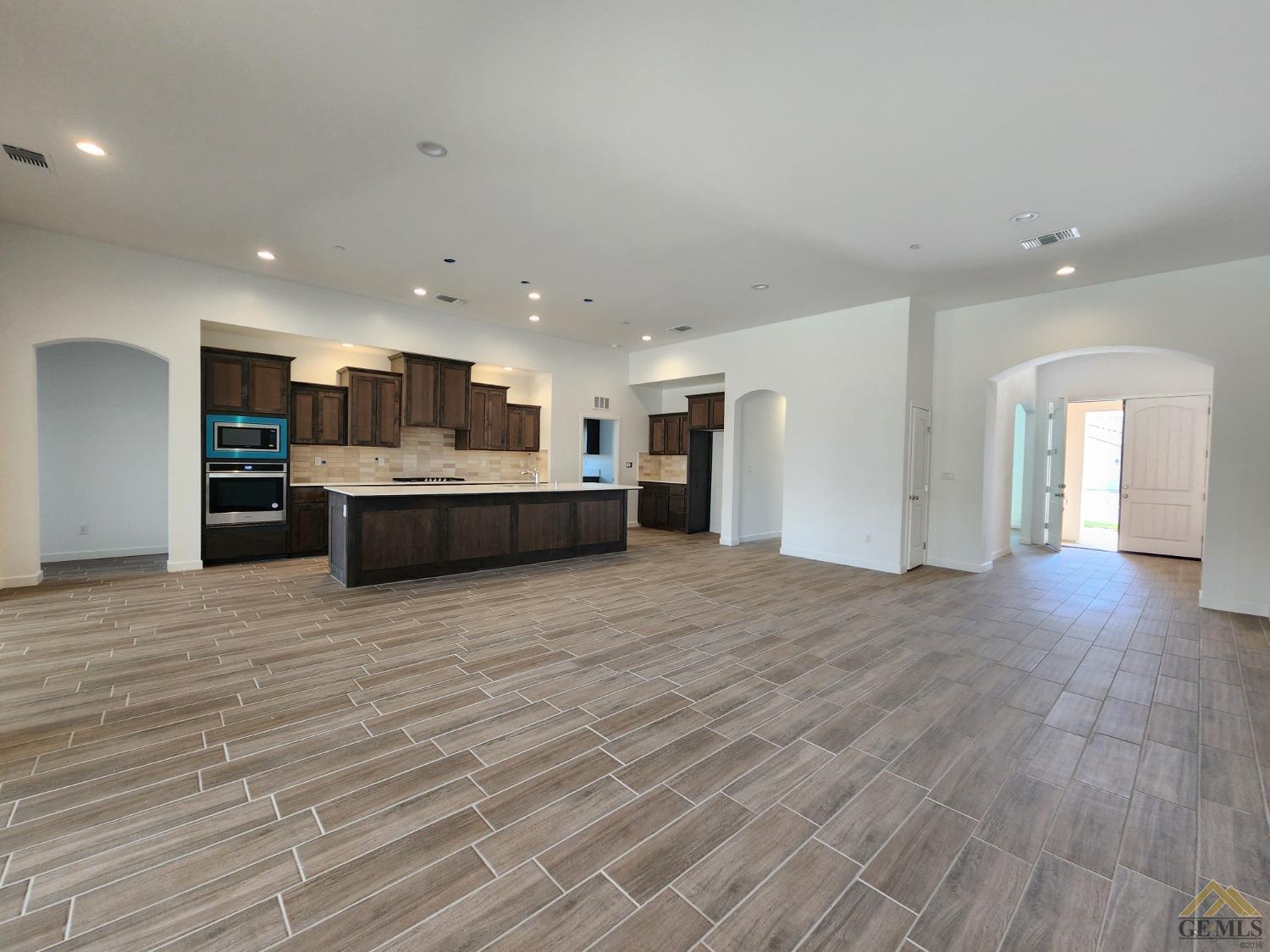Undisclosed Address Bakersfield, CA 93313 - Photo 2 of 22 a view of kitchen and kitchen with furniture wooden floor and window