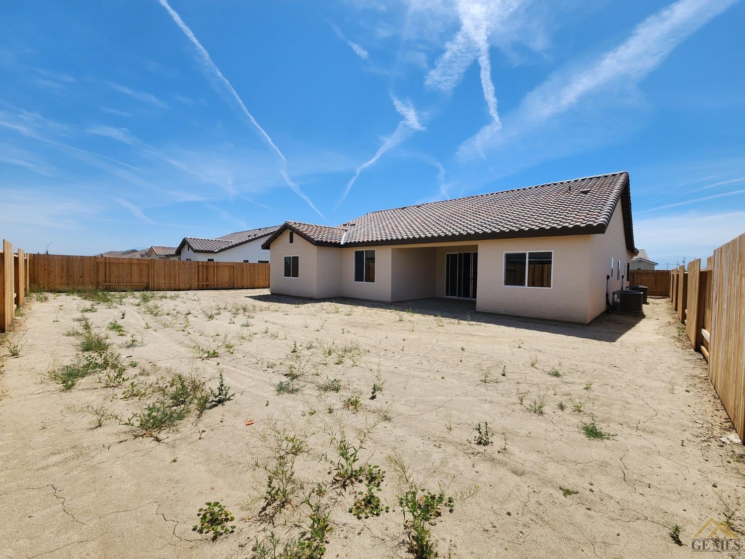 Undisclosed Address Bakersfield, CA 93313 - Photo 21 of 22 a big room with wooden fence