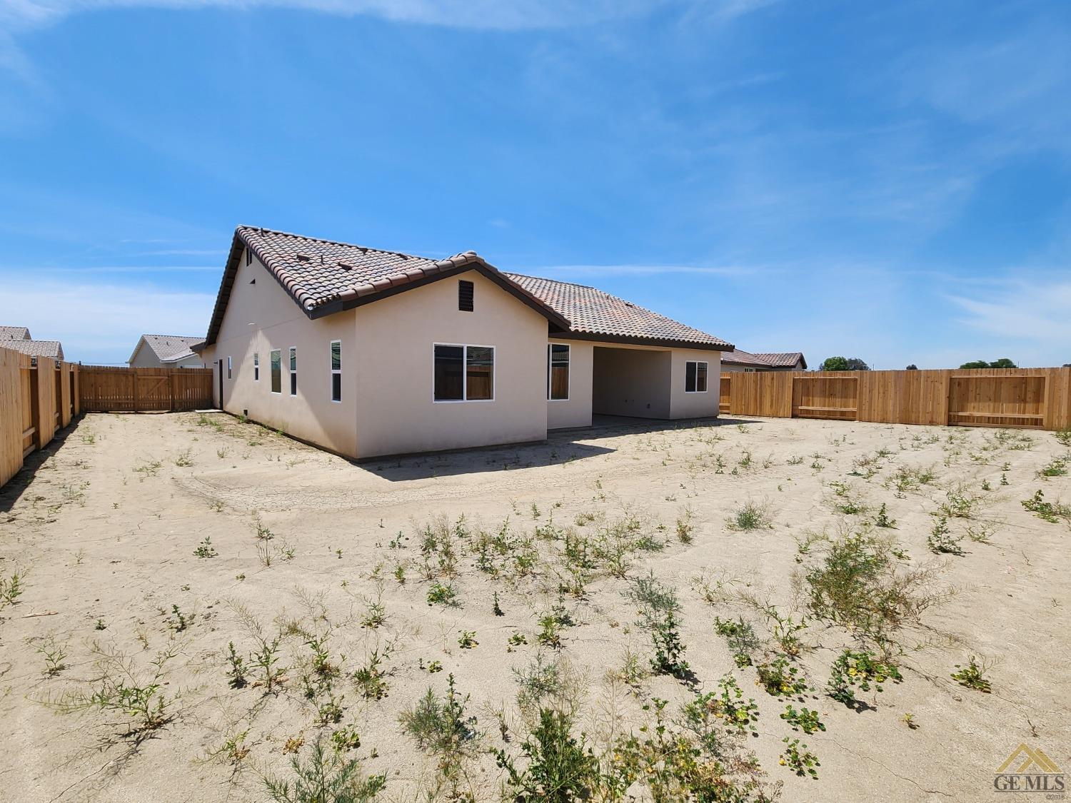 Undisclosed Address Bakersfield, CA 93313 - Photo 22 of 22 a view of a house with a snow in the background