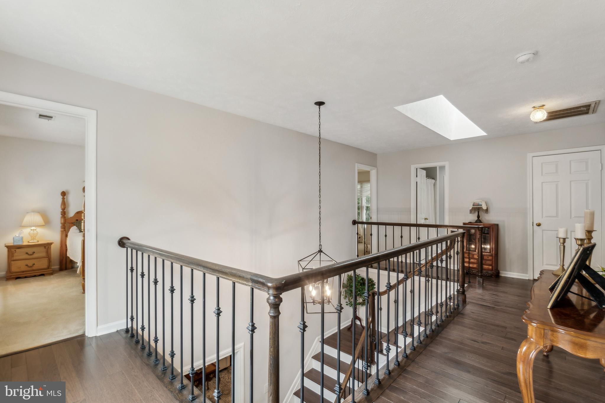 27 Rutherford Circle Sterling, VA 20165 - Photo 45 of 83 Upstairs hardwood floors, skylight