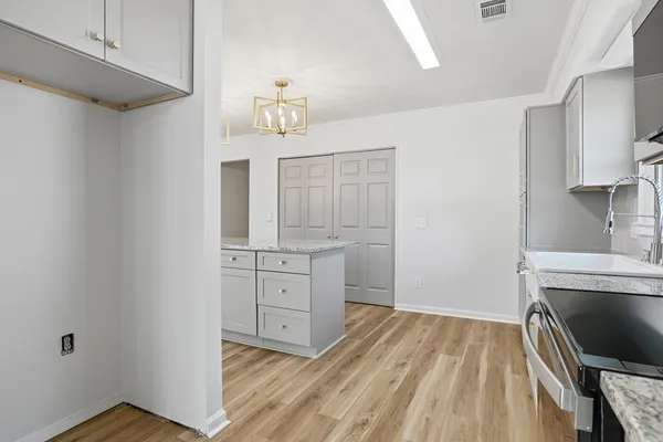 a kitchen with a stove and a microwave