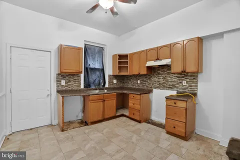 a kitchen with stainless steel appliances granite countertop a sink and cabinets
