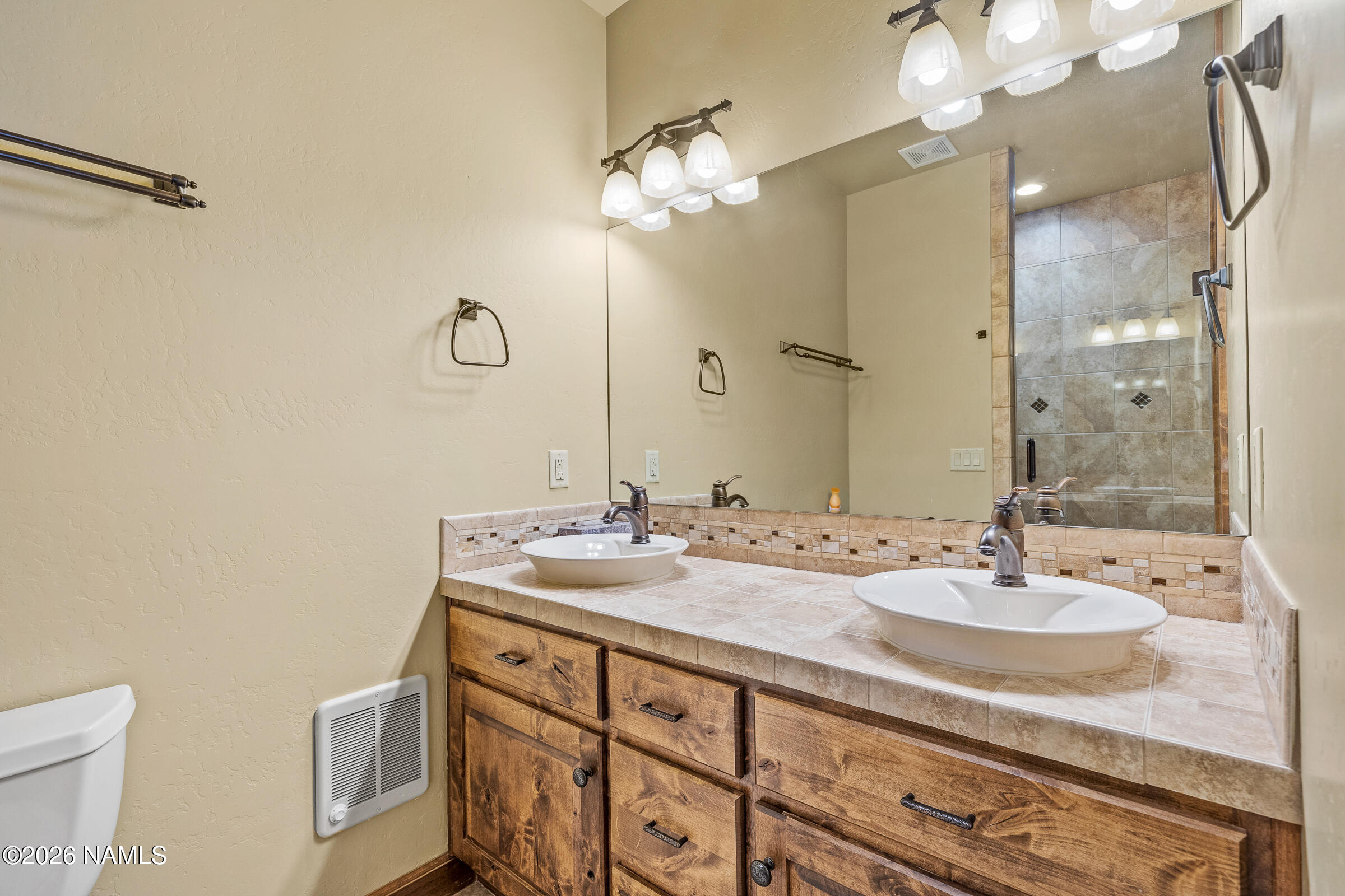 2214 East Del Rae Drive Flagstaff, AZ 86005 - Photo 20 of 45 a bathroom with a sink and a mirror