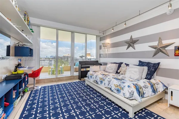 a bed room with a bed and a chair