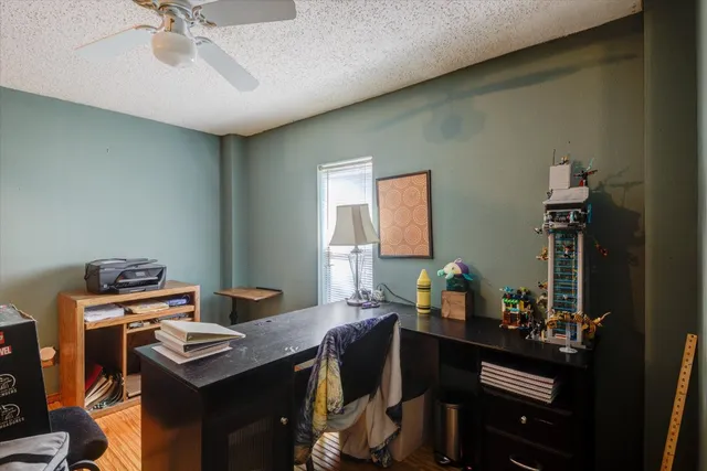 a backyard of a house with barbeque oven fire pit table and chairs