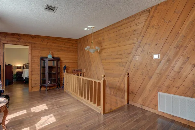 a backyard of a house with barbeque oven table and chairs