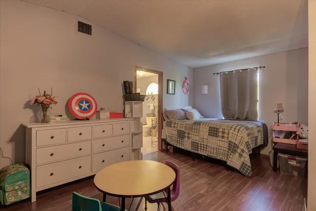 a view of a house with backyard porch and sitting area
