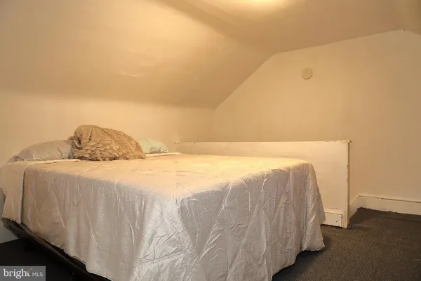 a bedroom with a bed and a cabinets
