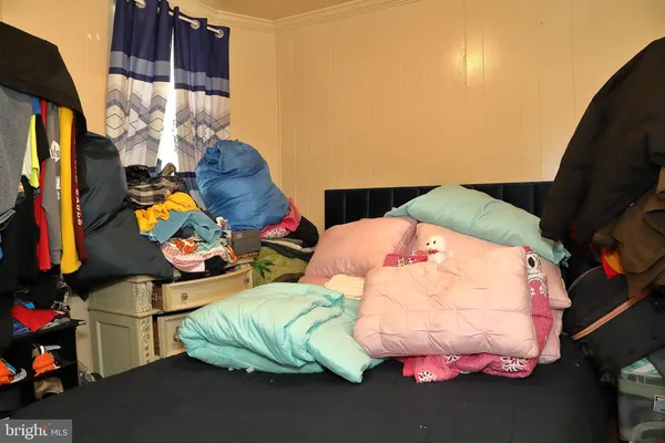 a bed room with furniture and a floor to ceiling window