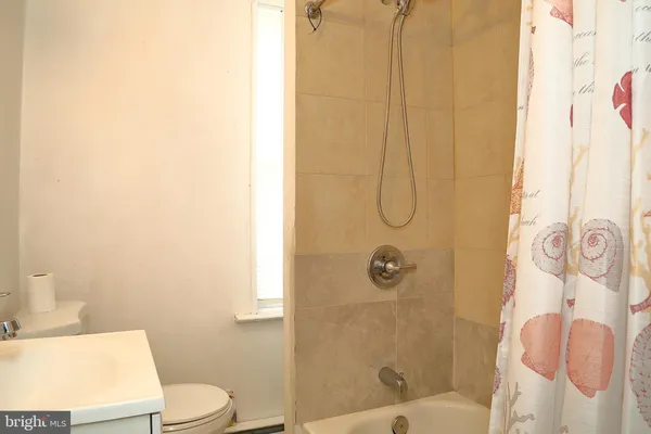 a bathroom with a shower curtain