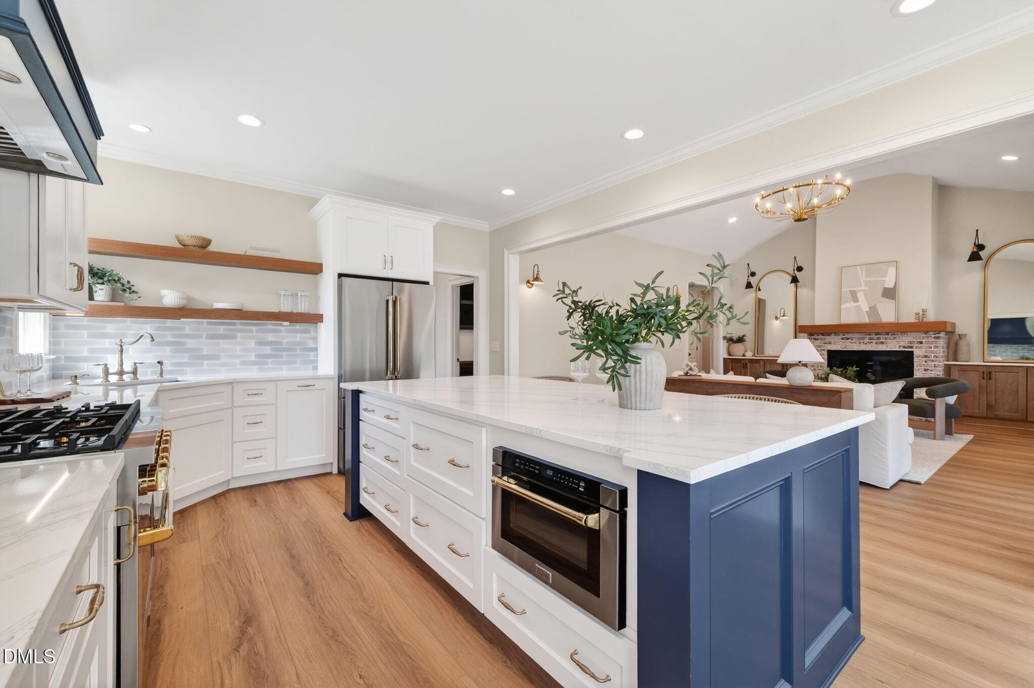 651 Dixon Road, Unit (LOT 2A) Willow Spring, NC 27592 - Photo 35 of 77 a kitchen with stainless steel appliances kitchen island wooden floors and stove