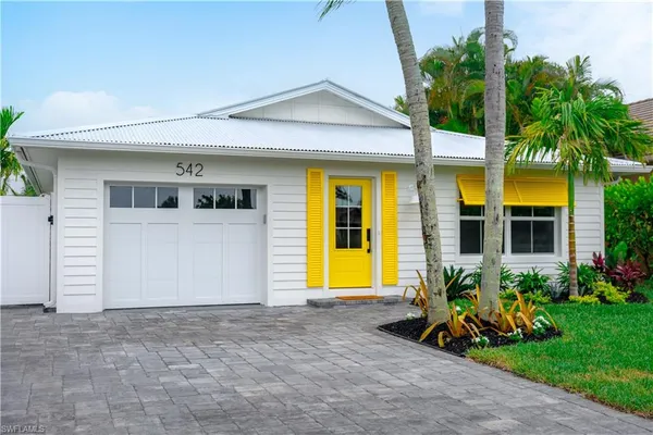 a front view of house with yard