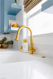 a kitchen with stainless steel appliances a sink stove and cabinets