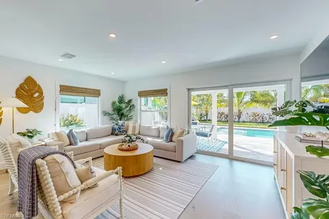 a kitchen that has a table and chairs in it