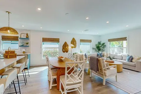 a bedroom with a bed a table and chair