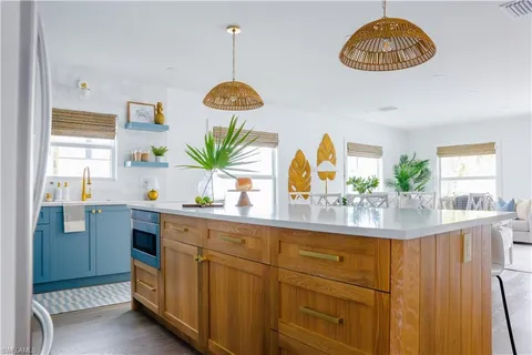 a stove top oven sitting inside of a kitchen