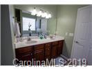 148 Roanoke Road Fletcher, NC 28732 - Photo 11 of 33 a bathroom with a sink and a mirror