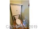 148 Roanoke Road Fletcher, NC 28732 - Photo 13 of 33 a bathroom with a toilet and a mirror