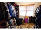148 Roanoke Road Fletcher, NC 28732 - Photo 14 of 33 a view of walk in closet with clothes